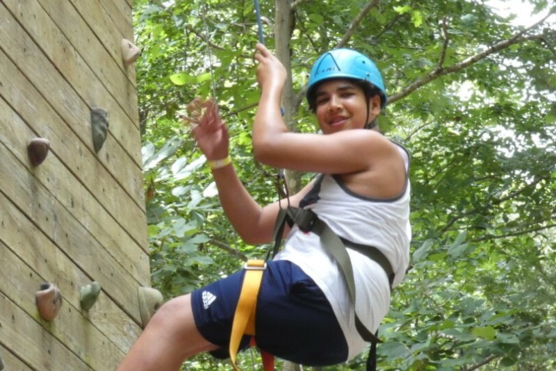 senior boy climbing